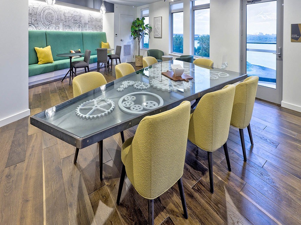 a dining room with a table and chairs